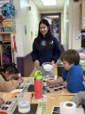 Volunteer working with students