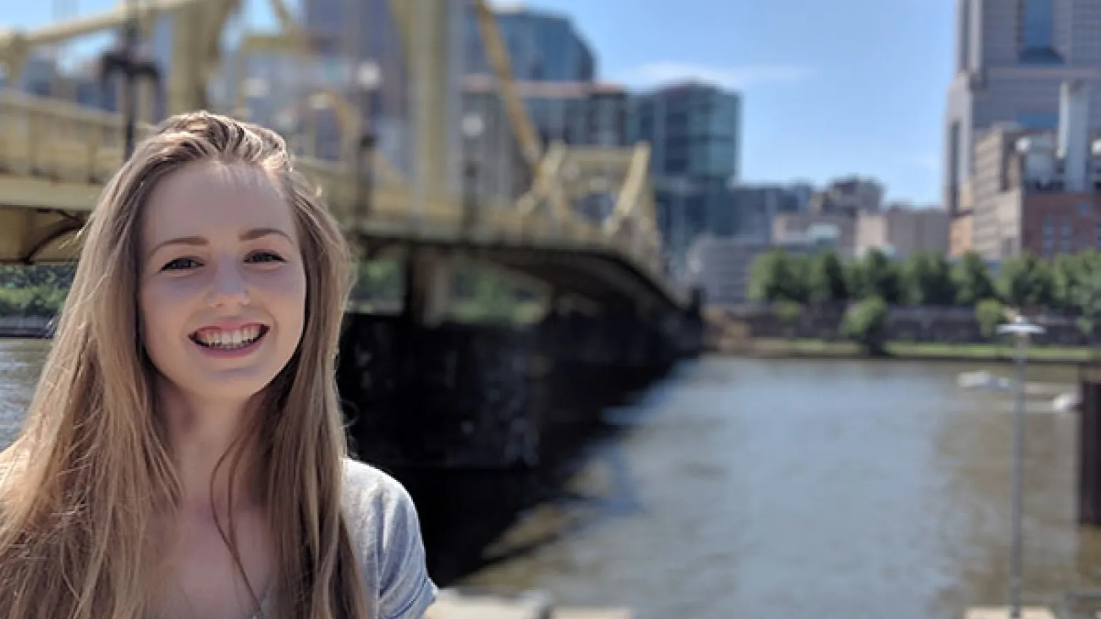 Photograph of Team Leader, Leah Dunston in front of downtown Columbus