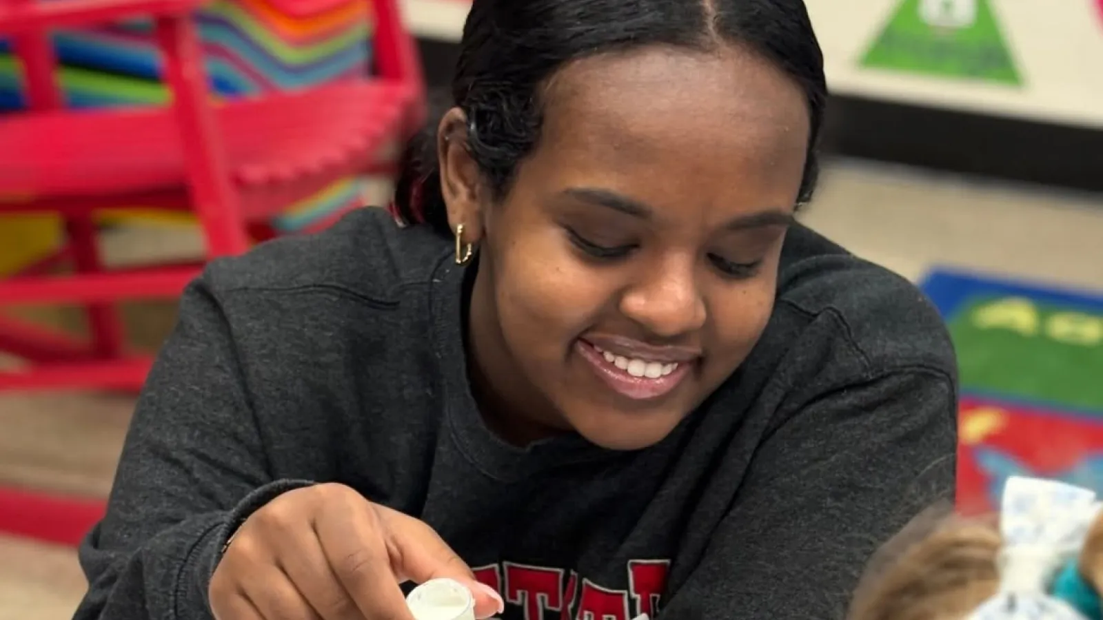 Hemen performing science experiment