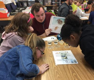 Photograph of Peter Dent talking to 4th grade students about water quality 