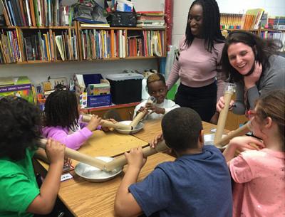 Photograph of Irene teaching 3rd graders of about sound and echolocation