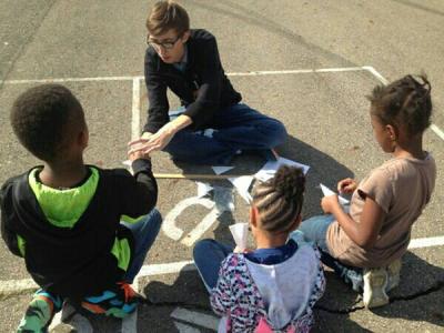 Photo of Andrew teaching 1st graders about airplanes