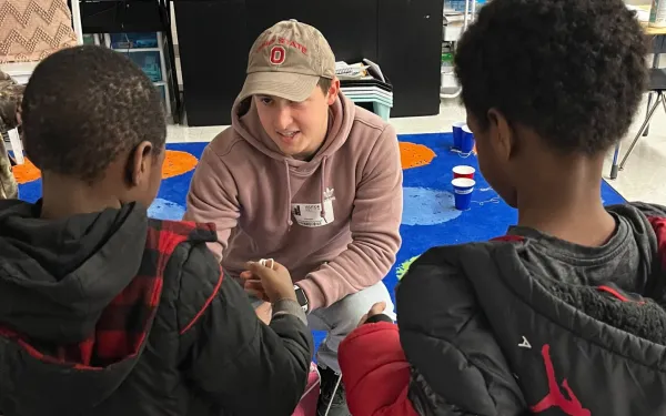 WOW volunteer working with elementary students