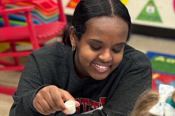 Hemen performing science experiment